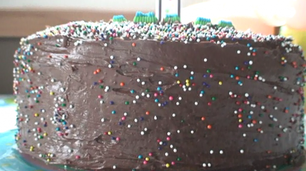 Side view. I remember it was NOT easy to get those sprinkles to stick to the side of the cake. What a strange angle to throw them at.
