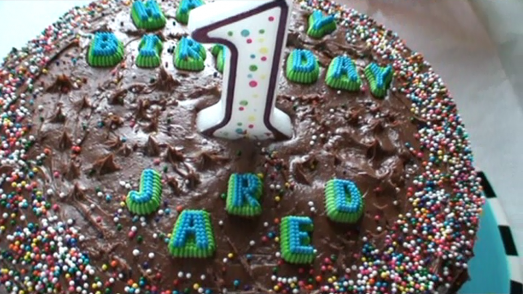 Close up of candle and letter toppings.